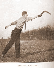 Photo of a man throwing a boomerang, with the caption,  "Second position."